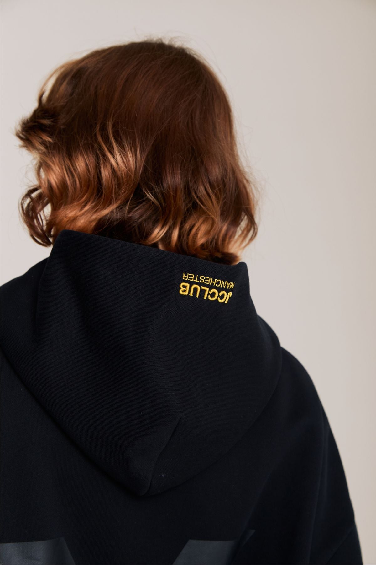 Woman wearing the black hoodie