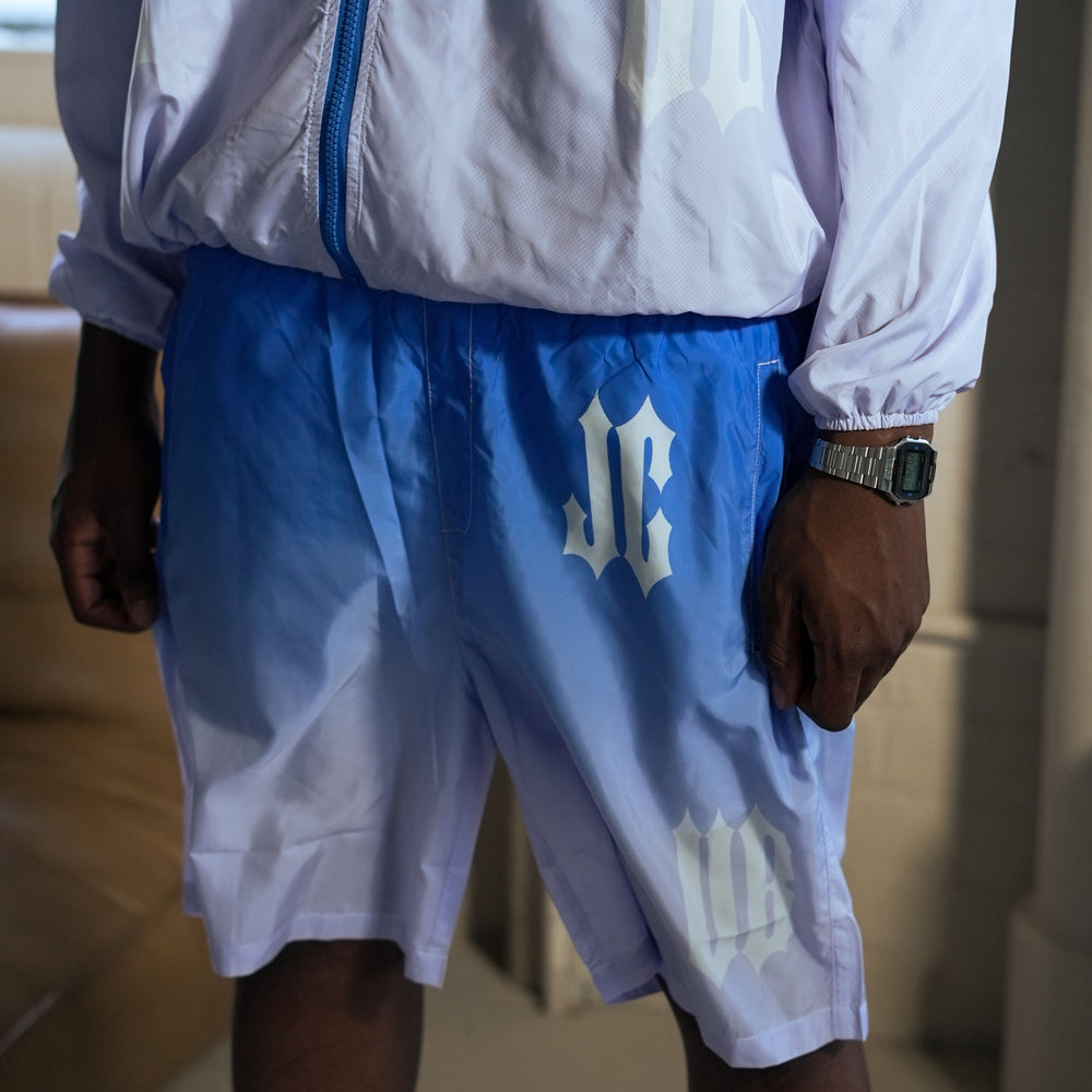 
                      
                        Gradient Windbreaker Shorts
                      
                    