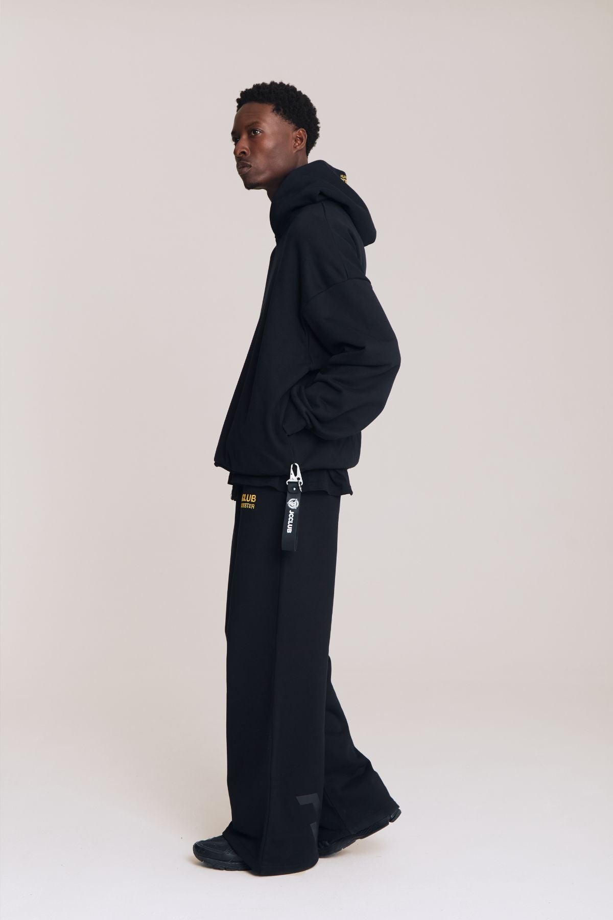 Man wearing the black hoodie