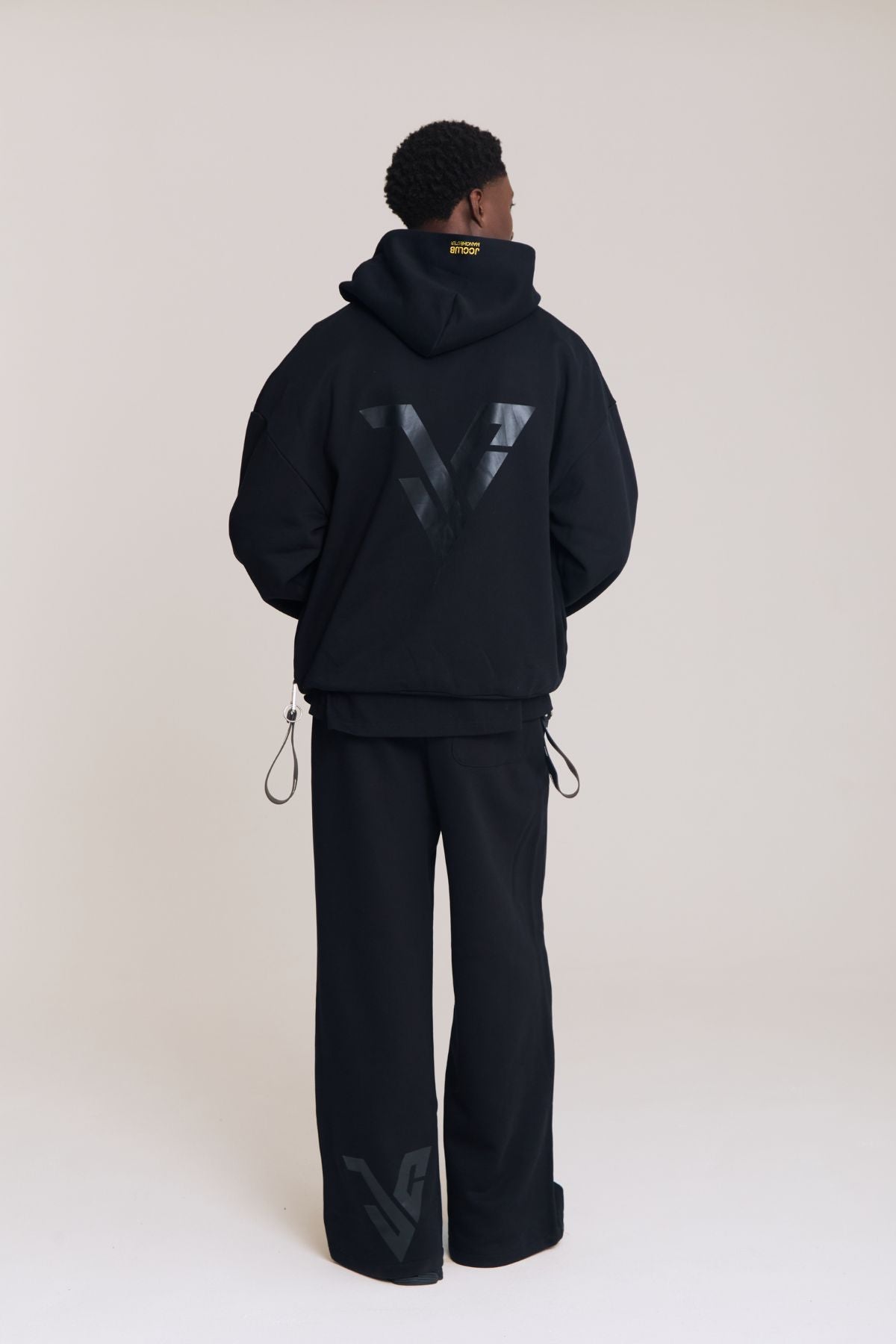 Man wearing the black hoodie