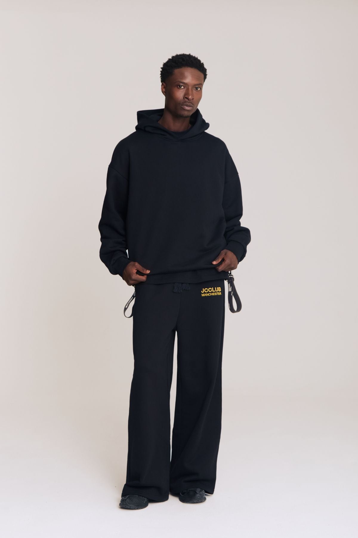 Man wearing the black hoodie