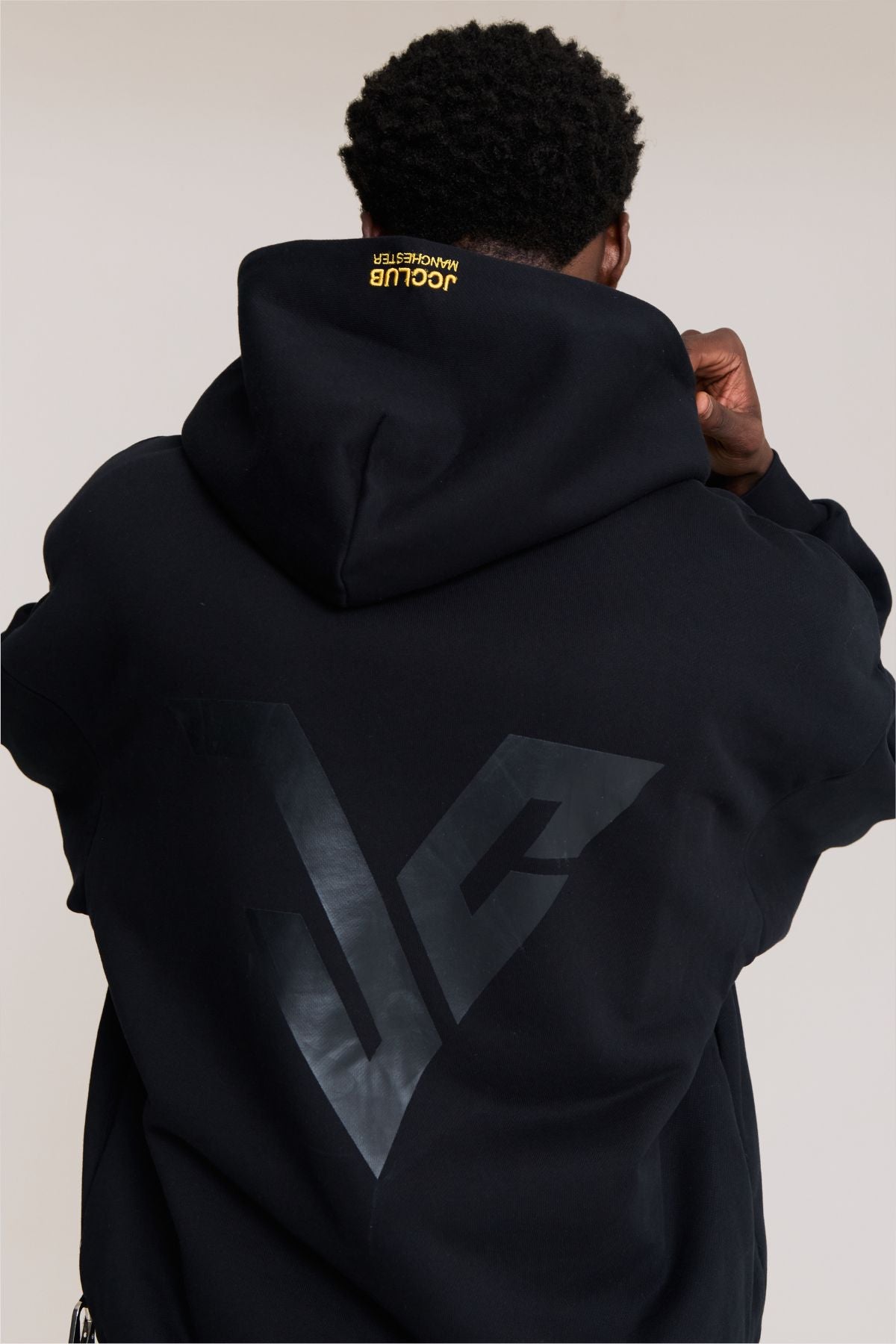 Man wearing the black hoodie
