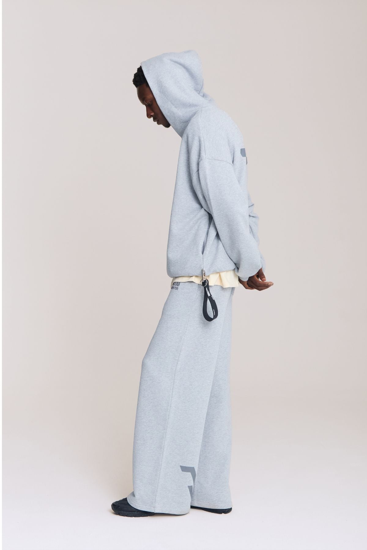 Man wearing the grey hoodie