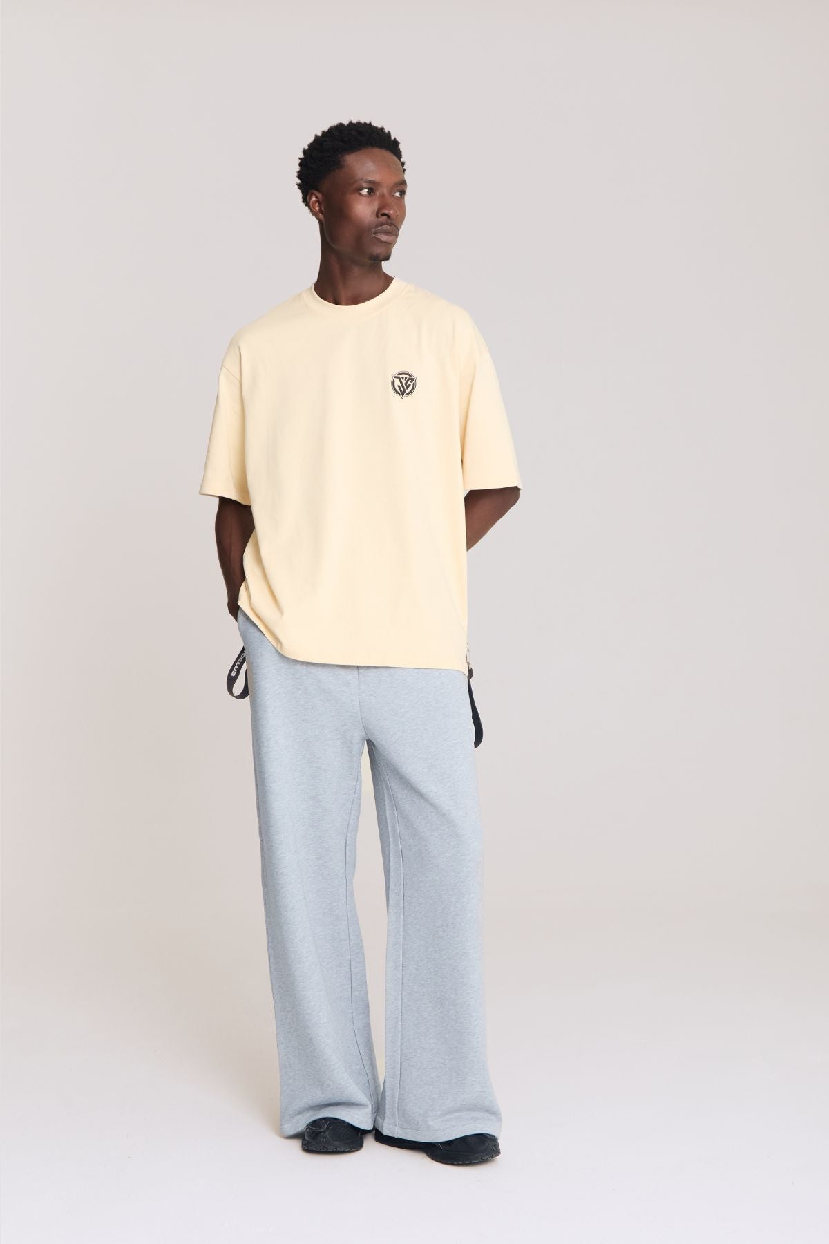 Man wearing the beige shirt