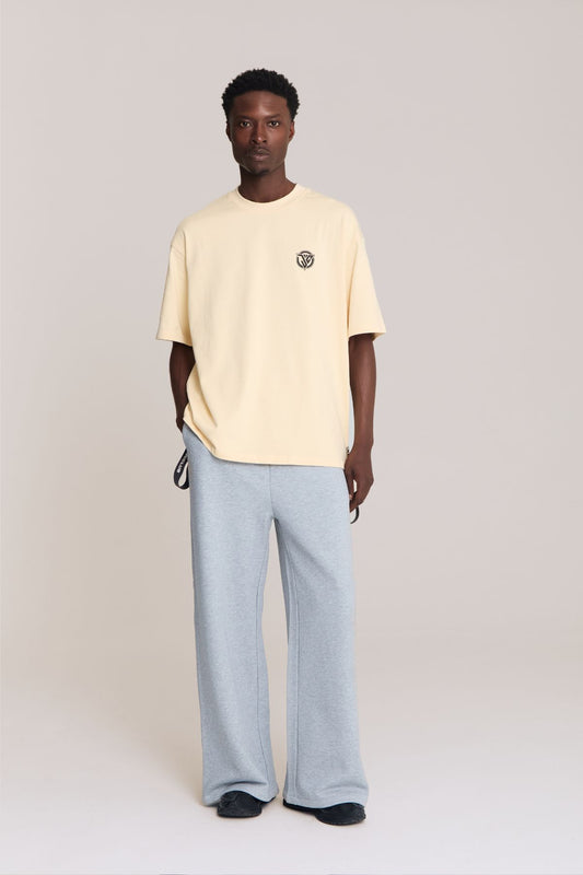 Man wearing the beige shirt