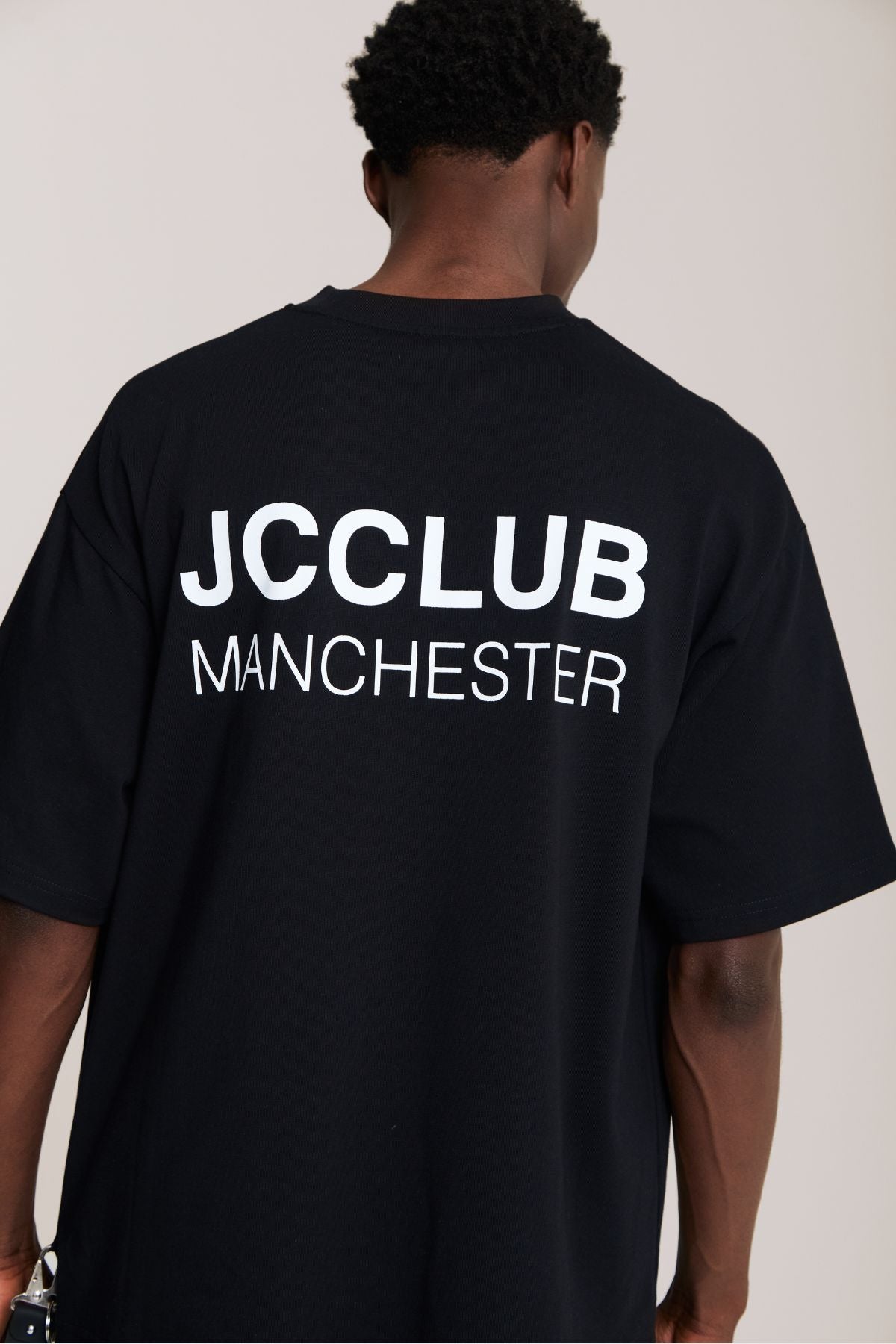 Man wearing the black shirt
