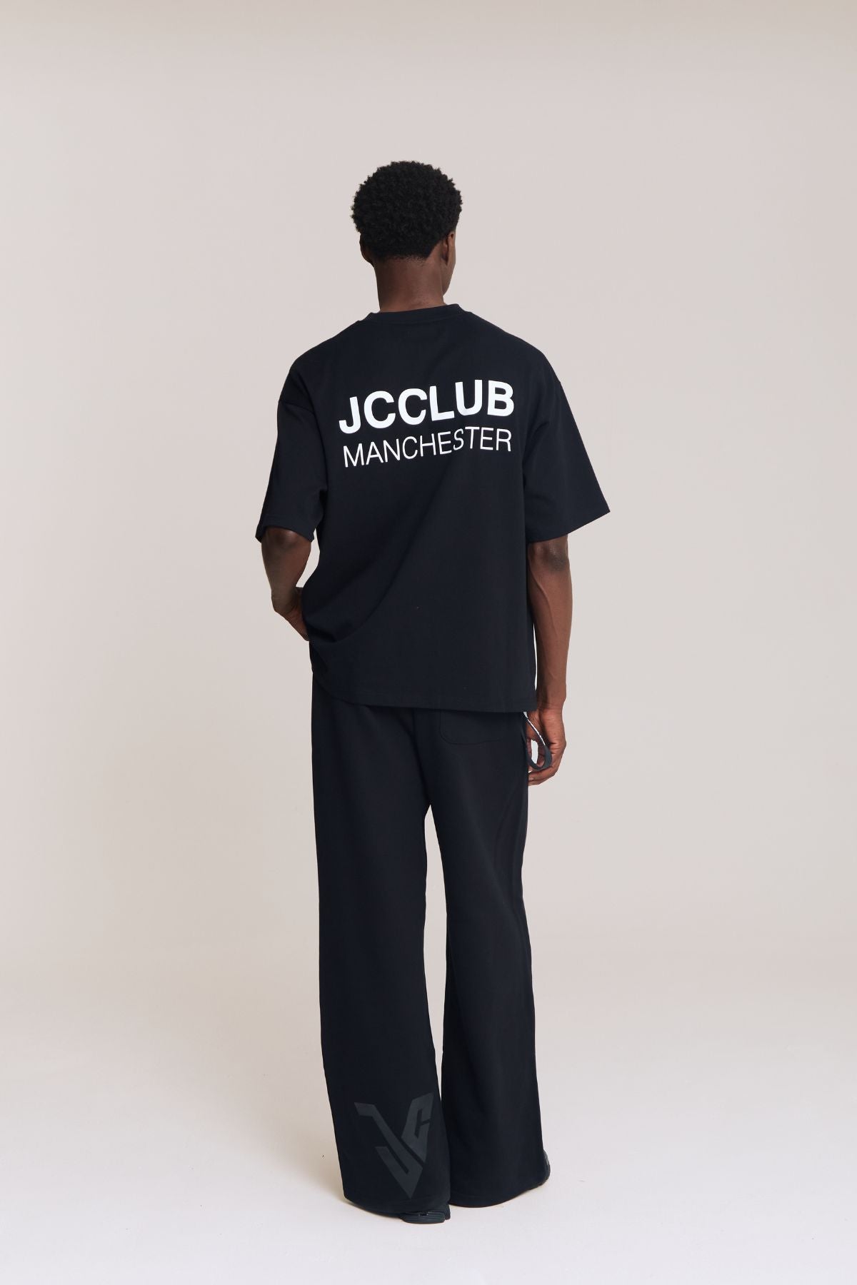 Man wearing the black shirt