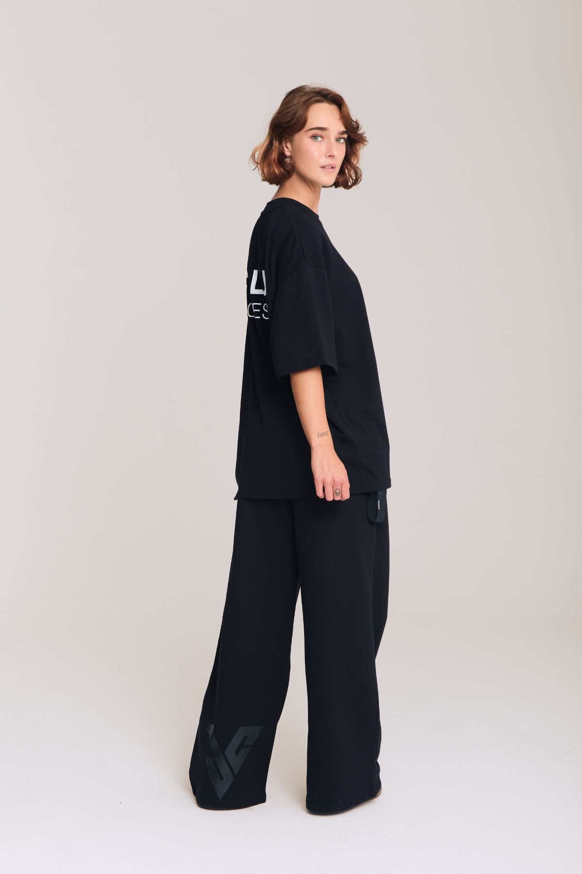 Woman wearing the black shirt
