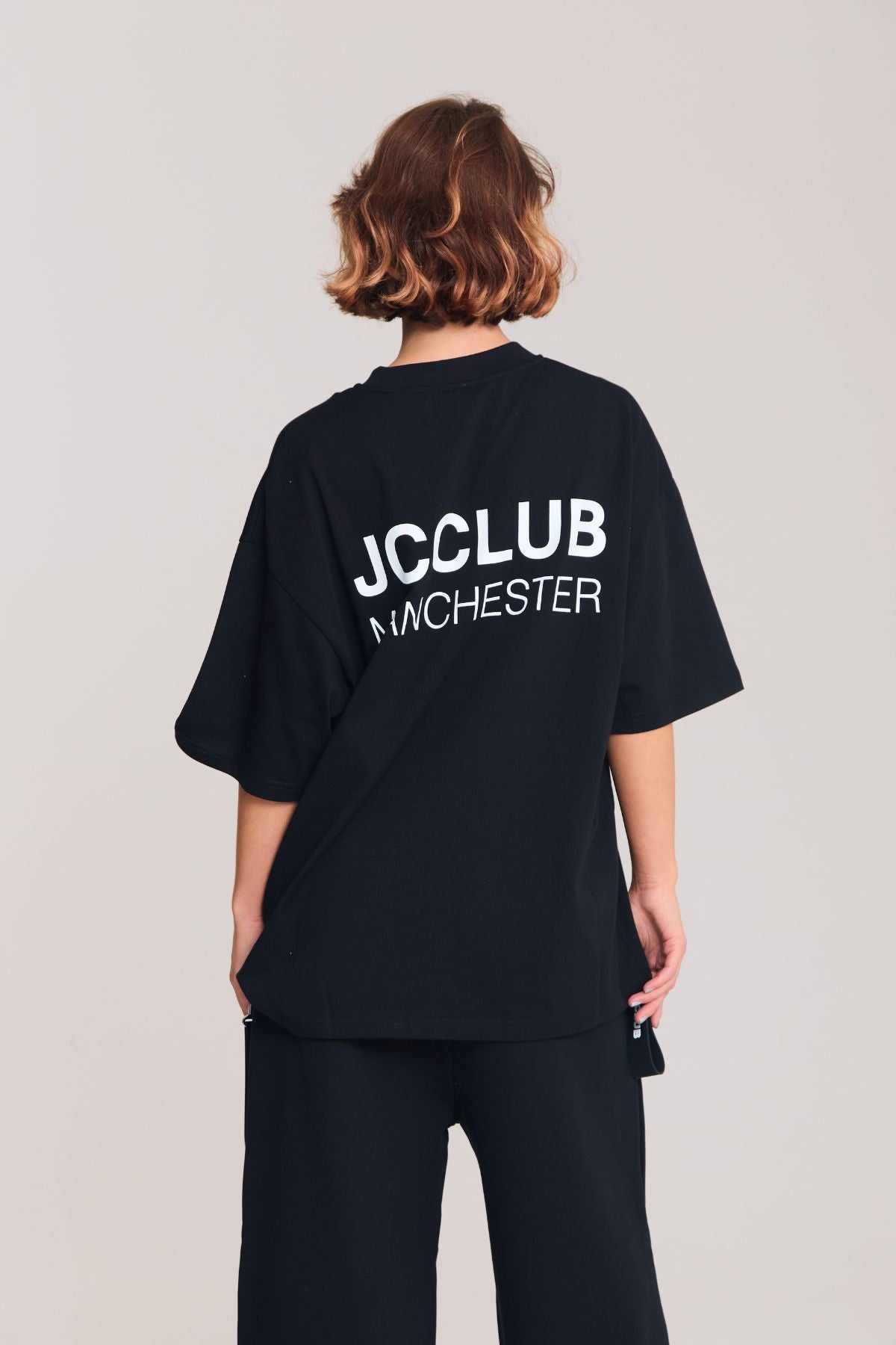 Woman wearing the black shirt