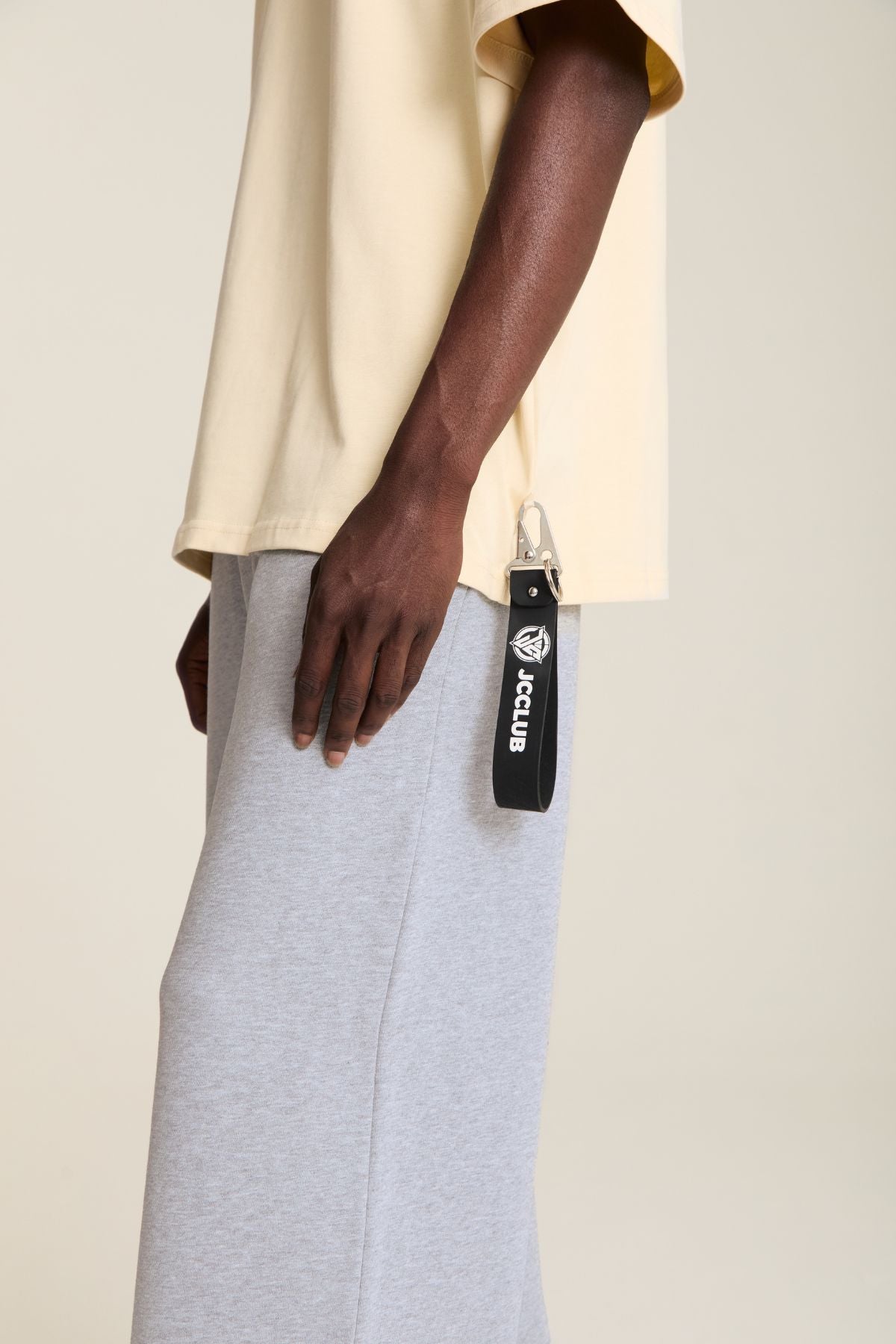 Man wearing the beige shirt