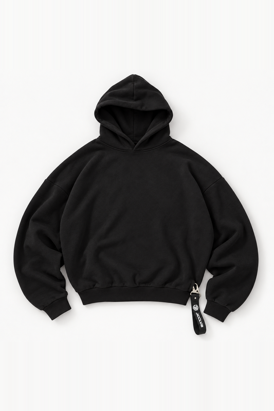 black hoodie flat lay